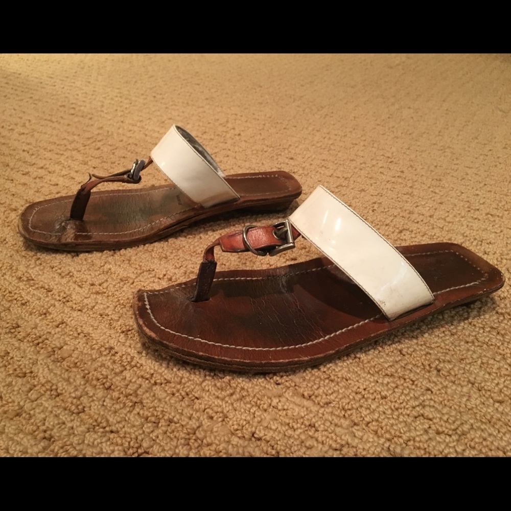 White patent leather Prada sandals.